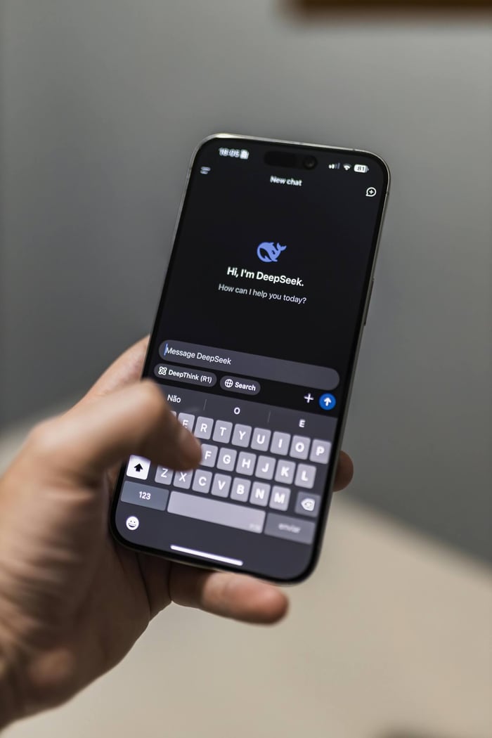 Close-up of a smartphone with an AI chat interface titled