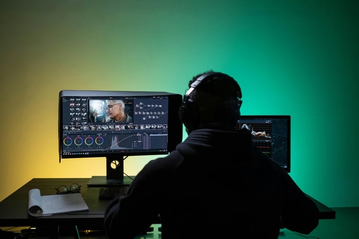 Marketer analyzing a dashboard showing AI citation metrics for their video content, measuring visibility