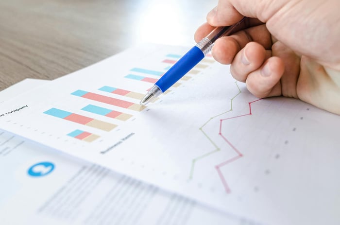 Data scientists collaborating to identify and correct biases in a large language model's training dataset
